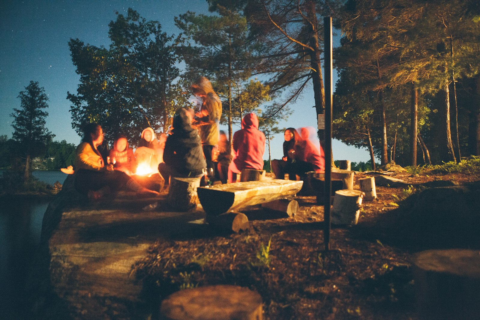 A warm tent interior at dusk, sleeping bags laid out.